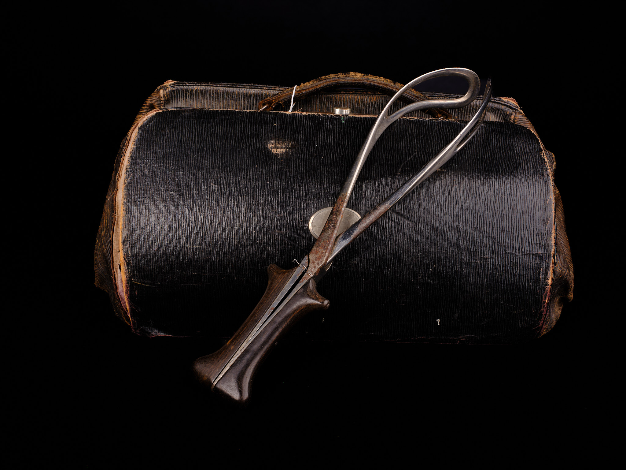 A midwife's leather case and obstetrics forceps 
