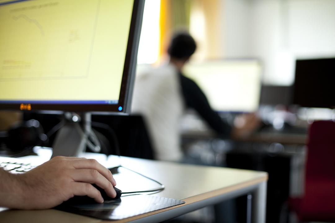 Hand in front of computer