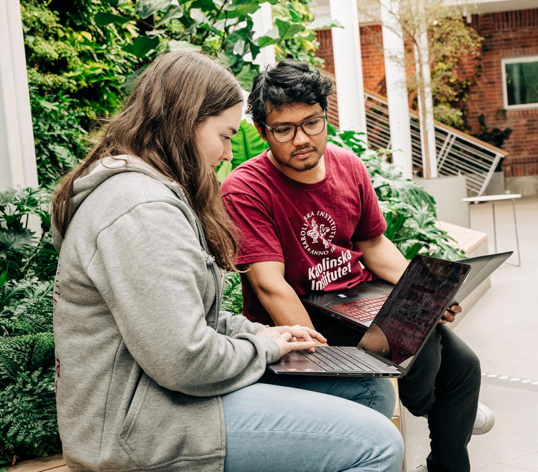 Two students in front of a computer.